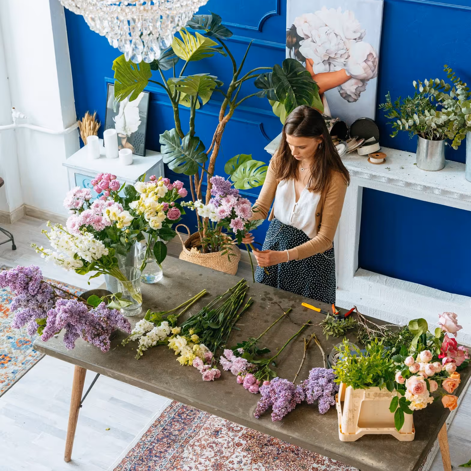 Florist assembling custom colour matched floral arrangement