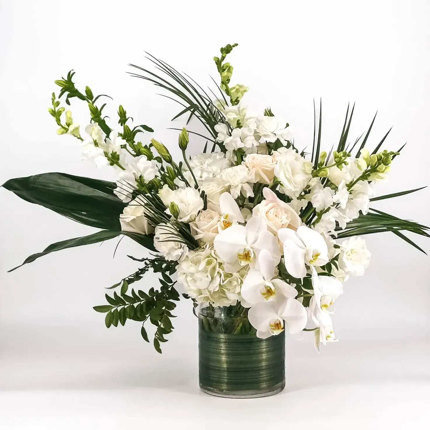 Subtle and dignified white floral sympathy arrangement